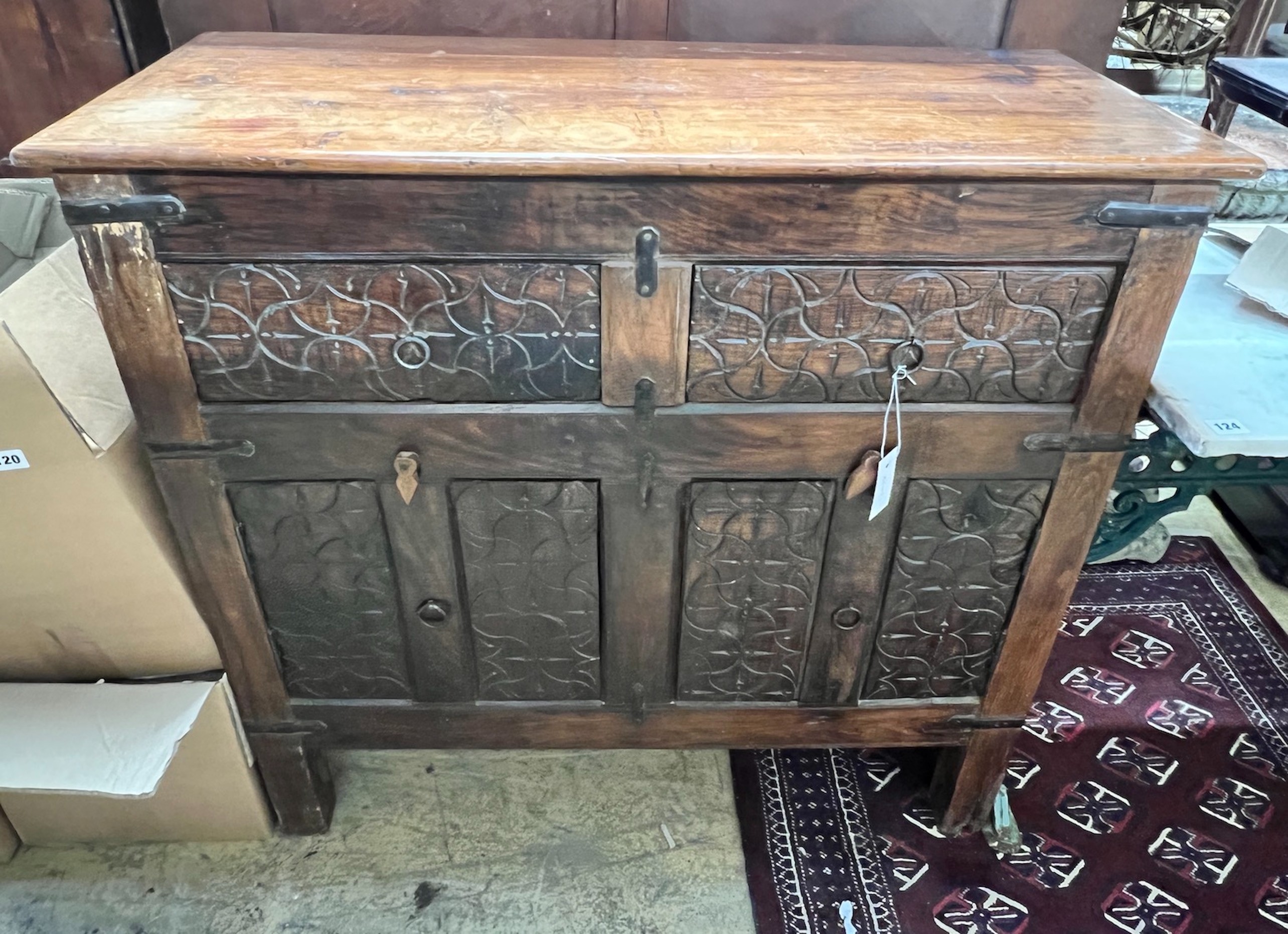 An Indian carved hardwood side cabinet, width 97cm, depth 41cm, height 93cm